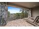 Spacious brick balcony with comfortable lounge chairs, offering beautiful panoramic views at 5085 Knobcone Dr, Castle Rock, CO 80108