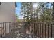Serene balcony with woodland views, outdoor seating, and sunlight, perfect for relaxing and entertaining at 5085 Knobcone Dr, Castle Rock, CO 80108