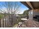 Inviting balcony with brick flooring and ornate table and chairs, offering a scenic view at 5085 Knobcone Dr, Castle Rock, CO 80108