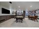 Finished basement with a billiards table, dining area, and sports memorabilia at 5085 Knobcone Dr, Castle Rock, CO 80108