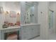 This luxurious bathroom includes a stylish vanity with a mirror, a makeup station, and elegant fixtures at 5085 Knobcone Dr, Castle Rock, CO 80108