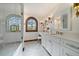 Elegant bathroom with tiled floors, a glass shower, and a vanity area with great lighting at 5085 Knobcone Dr, Castle Rock, CO 80108