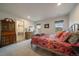 Bright bedroom with neutral carpet and ensuite bathroom at 5085 Knobcone Dr, Castle Rock, CO 80108