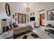 This bedroom features sporty decor, hardwood floors, and a private balcony with natural light at 5085 Knobcone Dr, Castle Rock, CO 80108