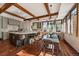 A bright dining area with hardwood floors, large windows, and a modern chandelier at 5085 Knobcone Dr, Castle Rock, CO 80108