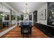 The dining room features hardwood floors and decor with a large mirror and a modern chandelier at 5085 Knobcone Dr, Castle Rock, CO 80108