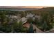An elegant home with stone accents, meticulous landscaping, and a basketball hoop in the driveway at 5085 Knobcone Dr, Castle Rock, CO 80108