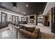 Spacious living room featuring a stone fireplace and comfortable sofa at 5085 Knobcone Dr, Castle Rock, CO 80108