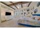 A spacious primary bedroom features a trey ceiling with a chandelier, built-ins, and custom wall decor at 5085 Knobcone Dr, Castle Rock, CO 80108