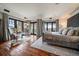 Serene main bedroom featuring hardwood floors, neutral tones, and access to a private balcony at 5085 Knobcone Dr, Castle Rock, CO 80108