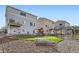 Backyard featuring a swing set, trampoline, stone patio, and spacious yard at 4746 River Highlands Loop, Elizabeth, CO 80107