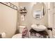 Well-lit powder room offers a modern sink, mirror, and decor at 4746 River Highlands Loop, Elizabeth, CO 80107