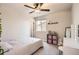 Neutral toned bedroom featuring a ceiling fan, window with blinds, carpet flooring, and a closet at 4746 River Highlands Loop, Elizabeth, CO 80107