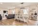 Spacious open-concept living and dining area featuring wood floors and lots of natural light at 4746 River Highlands Loop, Elizabeth, CO 80107
