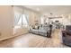 Open-concept living room showcases a comfortable couch and scenic views at 4746 River Highlands Loop, Elizabeth, CO 80107