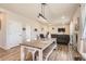 Spacious open-concept living and dining area featuring wood floors and comfortable furnishings at 4746 River Highlands Loop, Elizabeth, CO 80107