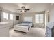 Bright main bedroom featuring a ceiling fan and carpeted floor at 4746 River Highlands Loop, Elizabeth, CO 80107