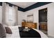 Bright bedroom featuring elegant decor and a view into a well-appointed bathroom at 27608 E Ottawa Ave, Aurora, CO 80016