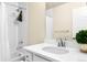 Well-lit bathroom with a white quartz counter, sleek vanity, and shower-tub combination at 320 Marshall Mews, Superior, CO 80027