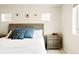 Bright bedroom with large windows, plush bed, and calming neutral decor at 320 Marshall Mews, Superior, CO 80027