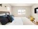 Bright bedroom with large window, plush bed, and calming neutral decor at 320 Marshall Mews, Superior, CO 80027