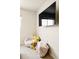 Cozy bedroom corner with a plush chair, blankets, and a wall-mounted television at 320 Marshall Mews, Superior, CO 80027