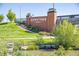 Brick 'Downtown Superior' entrance sign with manicured landscaping and serene water feature at 320 Marshall Mews, Superior, CO 80027