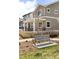 Charming two-story home with gray siding, a covered front porch, and a wood picket fence at 320 Marshall Mews, Superior, CO 80027