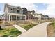 Inviting neighborhood street with well-maintained homes and sidewalks, ideal for strolling and enjoying the outdoors at 320 Marshall Mews, Superior, CO 80027