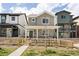 Charming two-story home with a picket fence and covered porch, perfect for relaxing and enjoying the neighborhood at 320 Marshall Mews, Superior, CO 80027