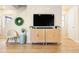 Modern living room featuring a TV, stylish furniture, and a decorative wreath, creating a cozy and inviting atmosphere at 320 Marshall Mews, Superior, CO 80027
