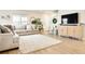 Bright and airy living room with a plush sofa, area rug, and a large window, offering comfort and style at 320 Marshall Mews, Superior, CO 80027