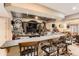 Finished basement bar area with granite countertops and stools at 815 Concho Ct, Castle Rock, CO 80104