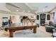Spacious finished basement with a pool table and entertainment area offers ample room for recreation and relaxation at 815 Concho Ct, Castle Rock, CO 80104