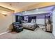 Cozy basement bedroom with recliner and custom decor at 815 Concho Ct, Castle Rock, CO 80104