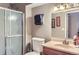 Cozy bathroom with shower stall, sink, and paper towel dispenser at 815 Concho Ct, Castle Rock, CO 80104