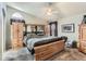 Comfortable bedroom with neutral colors, large bed, and unique built-in headboard at 815 Concho Ct, Castle Rock, CO 80104