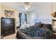 Well-lit bedroom with black dresser and a view from window at 815 Concho Ct, Castle Rock, CO 80104