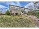 Spacious backyard with a covered deck and mature trees provides a private outdoor oasis at 815 Concho Ct, Castle Rock, CO 80104