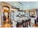 A gourmet kitchen with stainless steel appliances, a center island, and wood flooring at 815 Concho Ct, Castle Rock, CO 80104