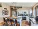 A gourmet kitchen with stainless steel appliances, a center island, and wood flooring at 815 Concho Ct, Castle Rock, CO 80104