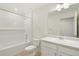 The bathroom features a shower/tub combo and a single vanity with updated hardware at 842 N Deer Park St, Watkins, CO 80137