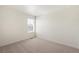 This bedroom features neutral carpet, double hung windows, and white trim at 842 N Deer Park St, Watkins, CO 80137