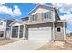 Charming two-story home featuring a two-car garage and a covered front porch at 842 N Deer Park St, Watkins, CO 80137