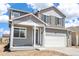Charming two-story home featuring a two-car garage and a covered front porch at 842 N Deer Park St, Watkins, CO 80137