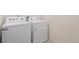 A bright laundry room features a newer washer and dryer at 842 N Deer Park St, Watkins, CO 80137
