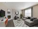 Modern living room showcasing stylish furniture and a cozy fireplace feature at 842 N Deer Park St, Watkins, CO 80137