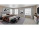 Spacious main bedroom featuring ample natural light and neutral decor at 842 N Deer Park St, Watkins, CO 80137