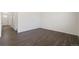 Bright room with wood flooring and light walls, ready for customization at 842 N Deer Park St, Watkins, CO 80137