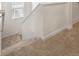 Carpeted staircase with white trim leading to the upper level of the house at 842 N Deer Park St, Watkins, CO 80137